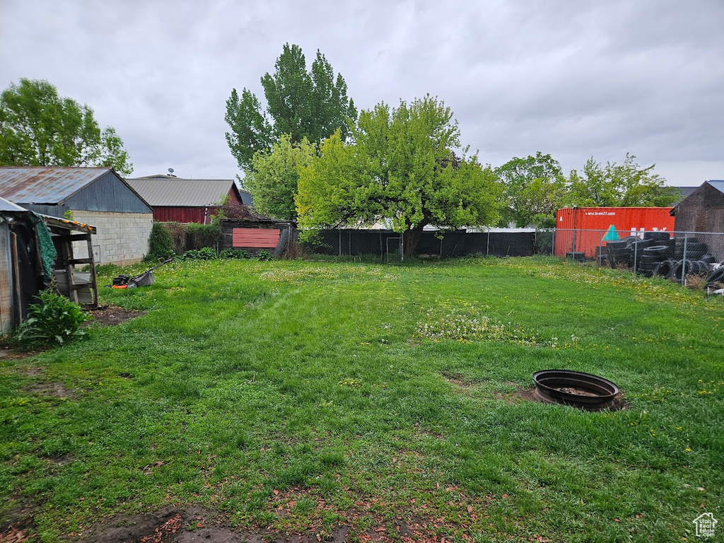 View of yard featuring fence