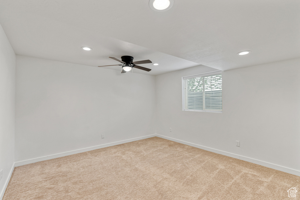 Empty room with light colored carpet, ceiling fan, recessed lighting, and baseboards