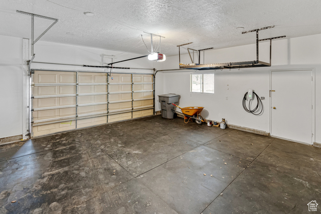 Garage featuring a garage door opener