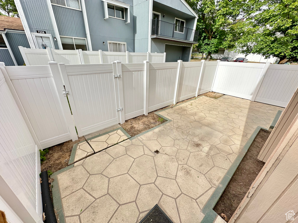 View of patio / terrace featuring fence and a gate