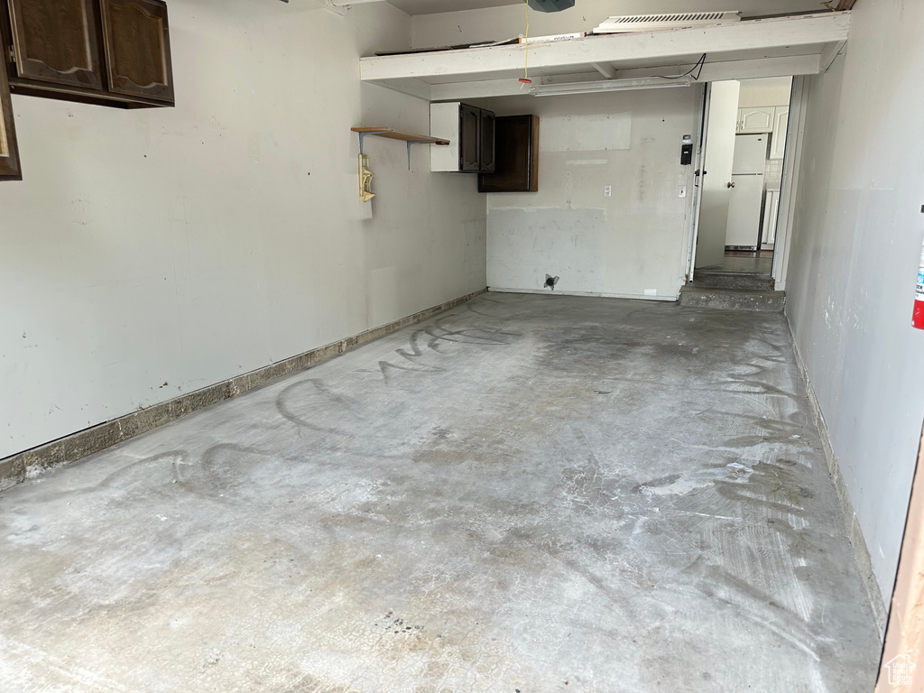 Garage with freestanding refrigerator