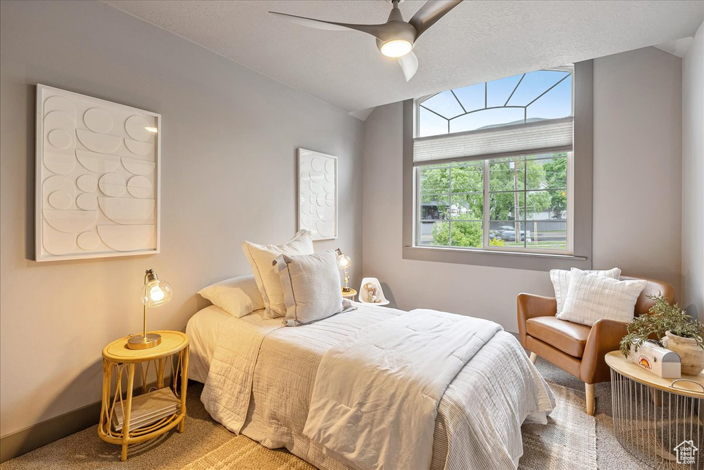 Bedroom with carpet and ceiling fan