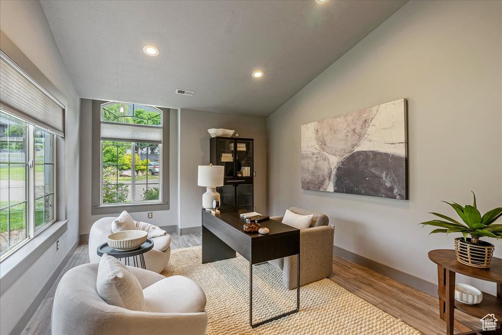 Office featuring vaulted ceiling, recessed lighting, wood finished floors, and baseboards