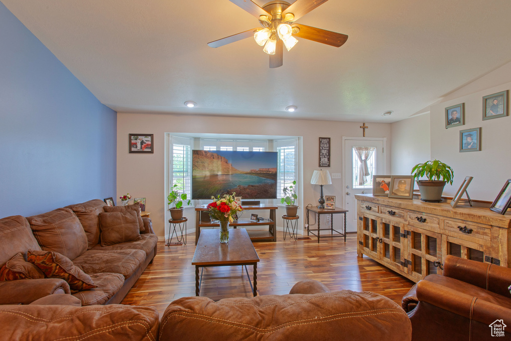 Living area featuring ceiling fan, wood finished floors, and recessed lighting