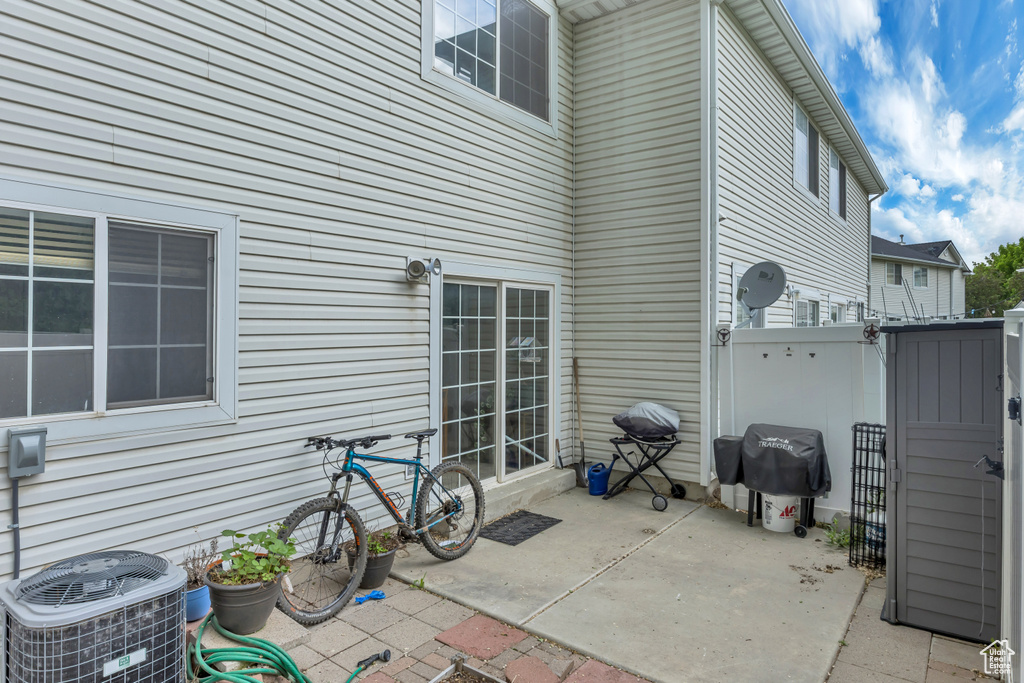 View of patio / terrace featuring cooling unit and area for grilling