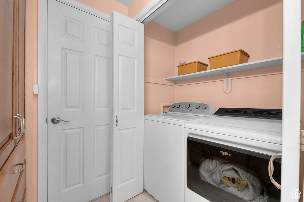 Laundry room featuring washer and clothes dryer