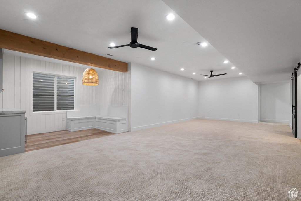 Spare room with ceiling fan, light carpet, recessed lighting, and baseboards