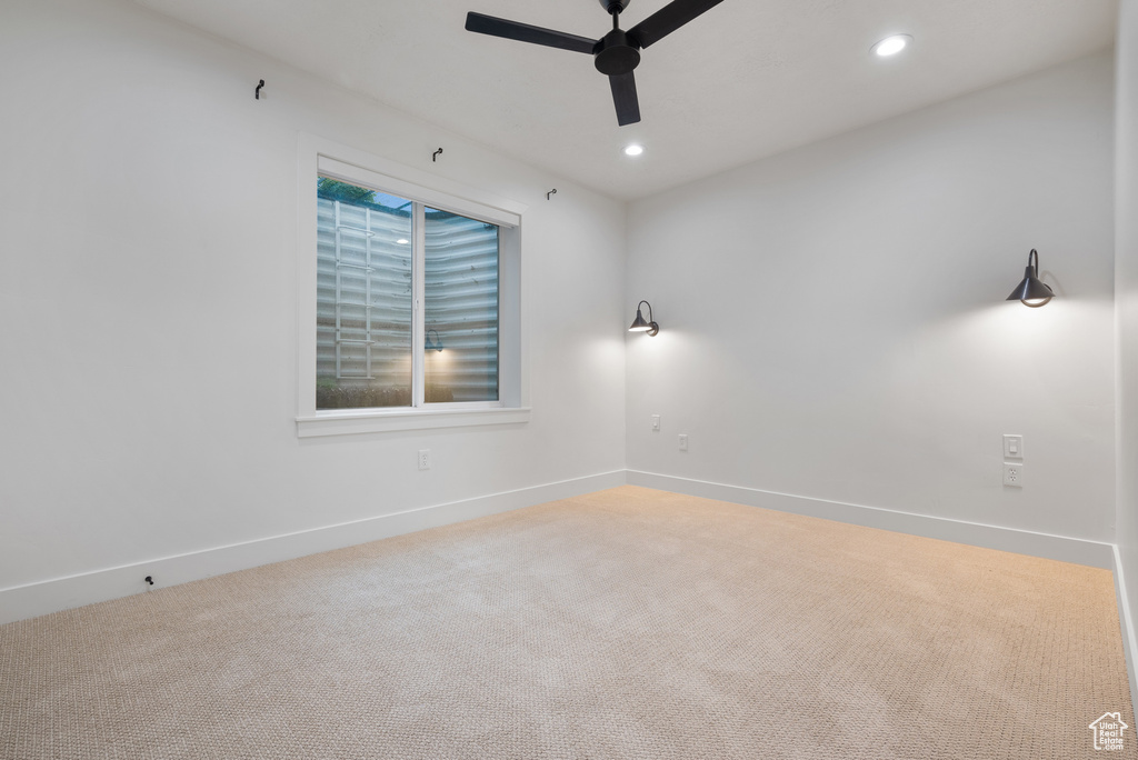 Spare room featuring ceiling fan, carpet, baseboards, and recessed lighting