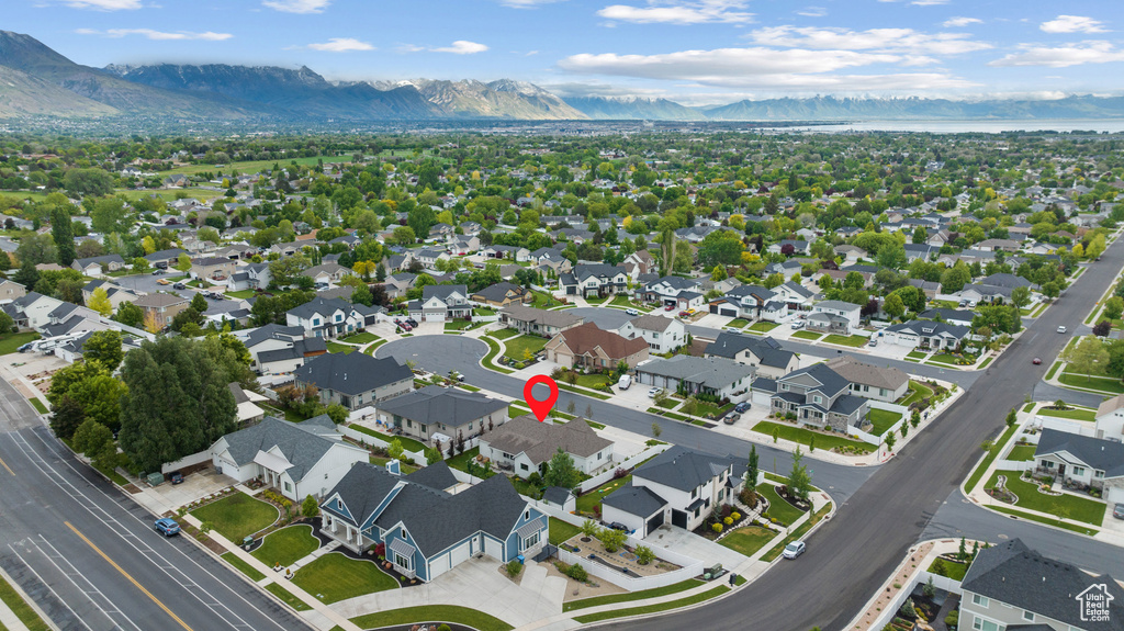 Aerial view of property\\\\\\\'s location featuring a mountain backdrop and nearby suburban area