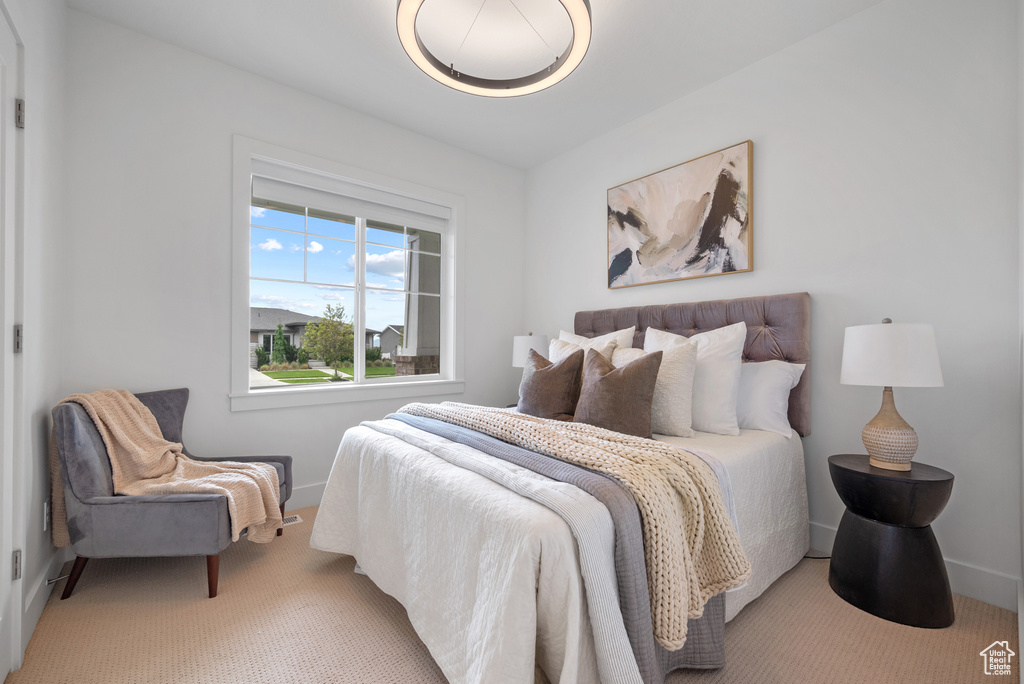 Carpeted bedroom with baseboards