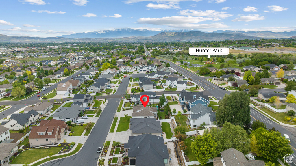 Aerial overview of property\\\\\\\'s location featuring a mountain backdrop and nearby suburban area