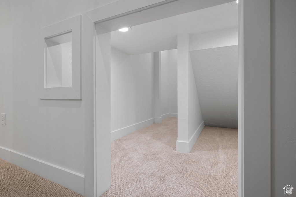 Hall with carpet floors, baseboards, and recessed lighting