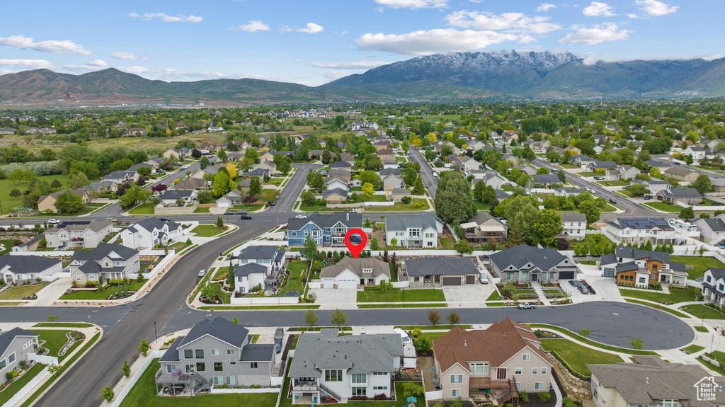 Aerial view of residential area featuring a mountain backdrop