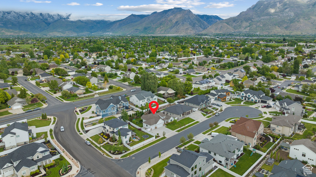 View of property location featuring mountains and nearby suburban area