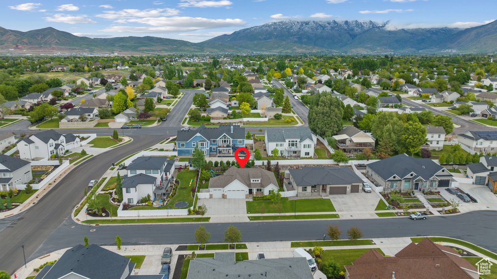 Aerial perspective of suburban area with a mountain backdrop