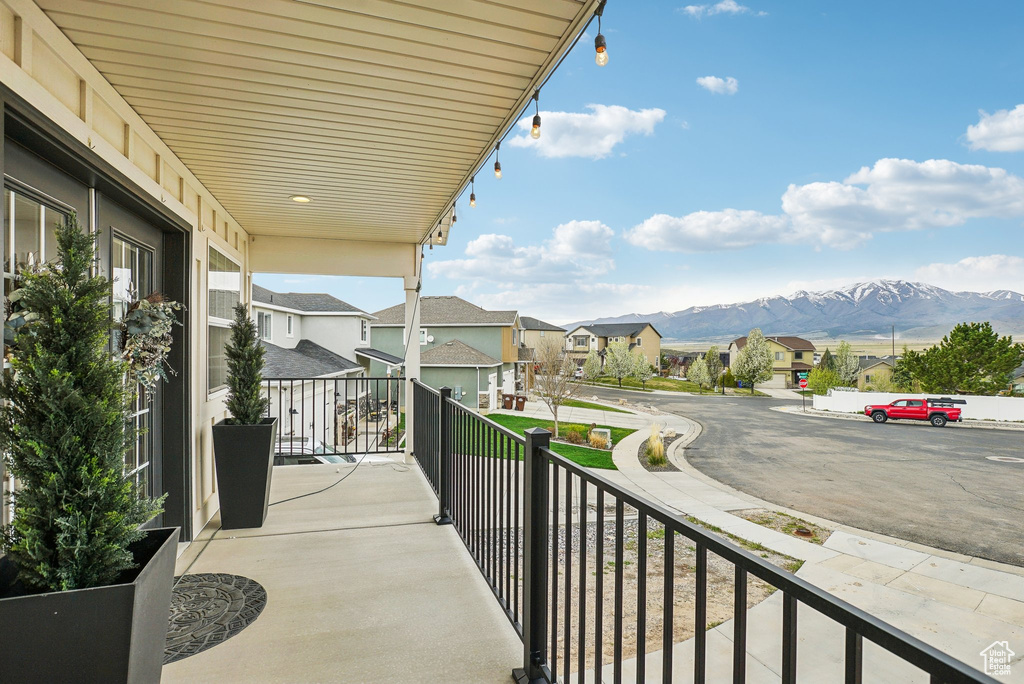 Balcony featuring a mountain view and a residential view