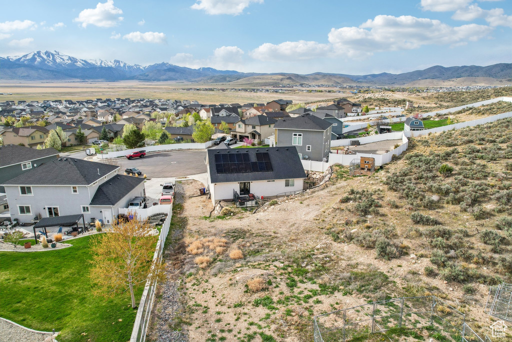 Aerial view of residential area featuring a mountain backdrop