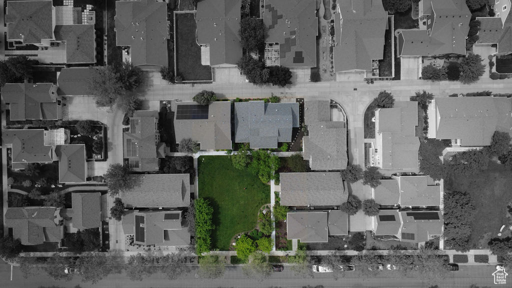 Aerial view of property and surrounding area with nearby suburban area