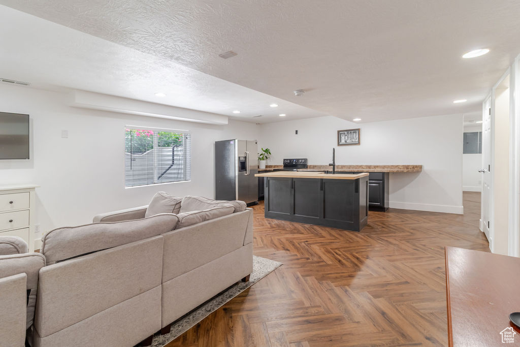 Living area featuring recessed lighting and baseboards