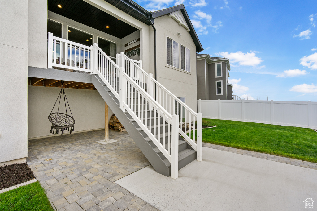 View of patio featuring stairway