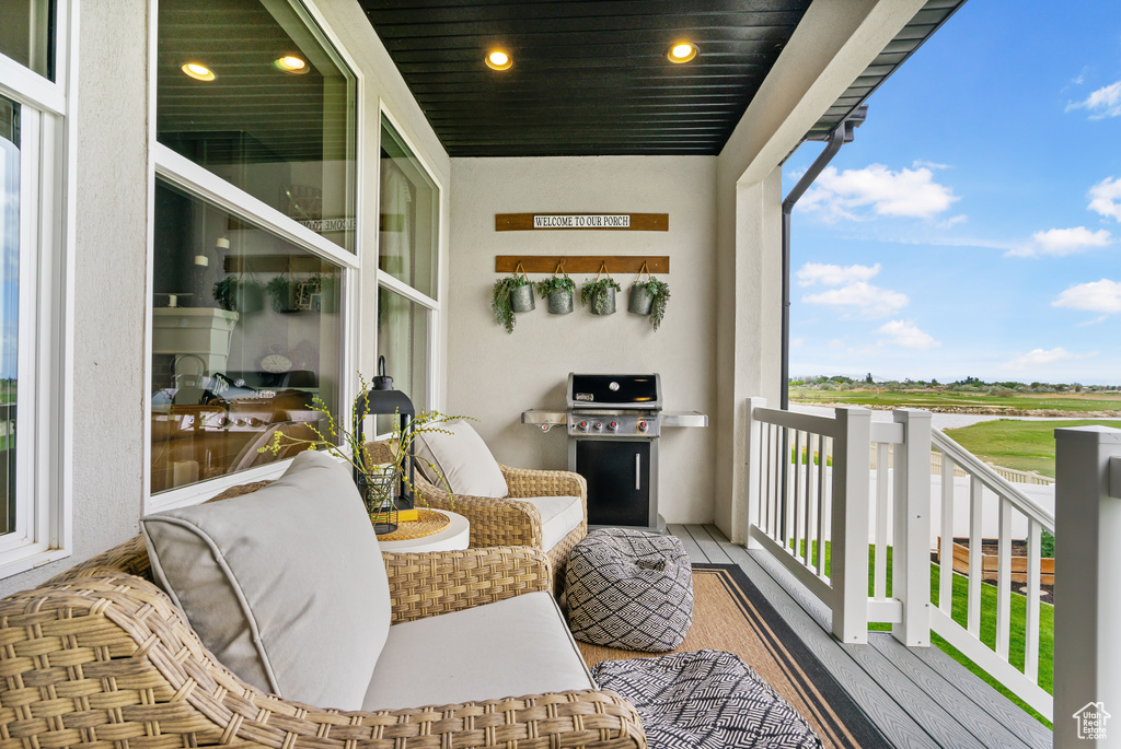 Balcony featuring area for grilling