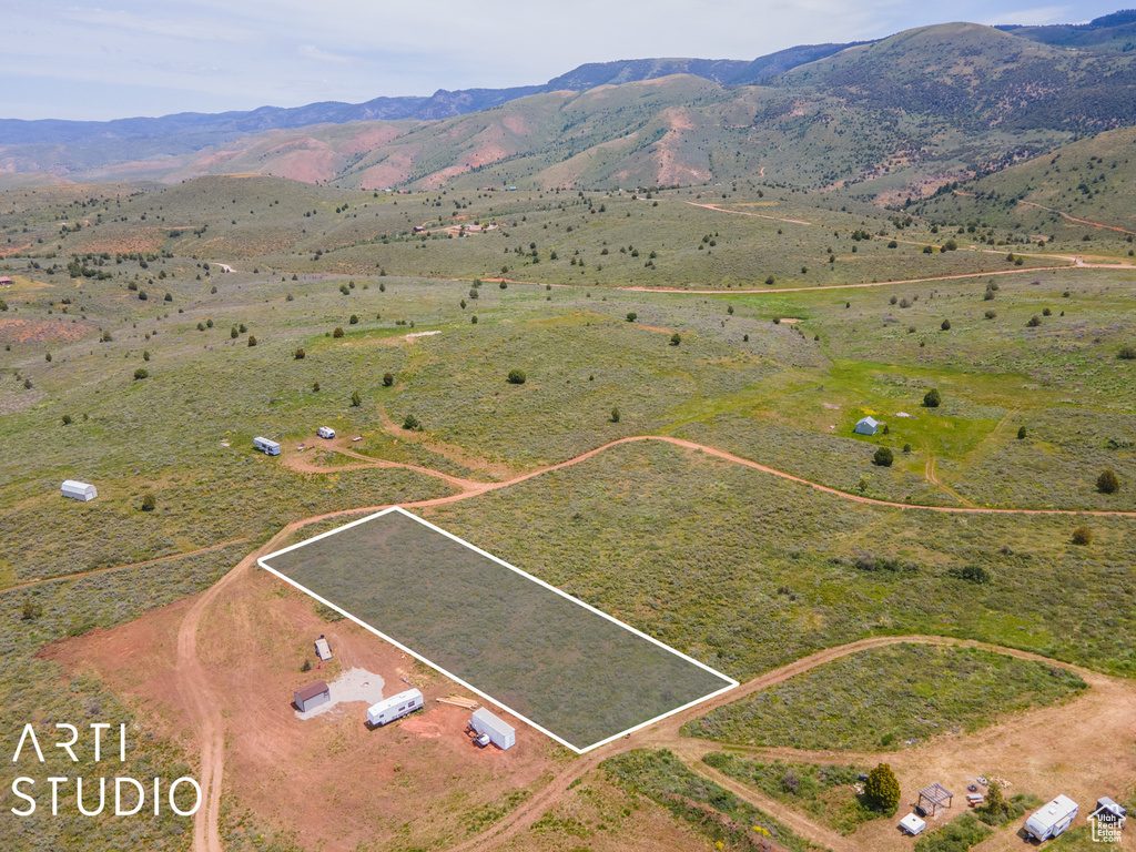 View of rural area with property parcel outlined and a mountain backdrop