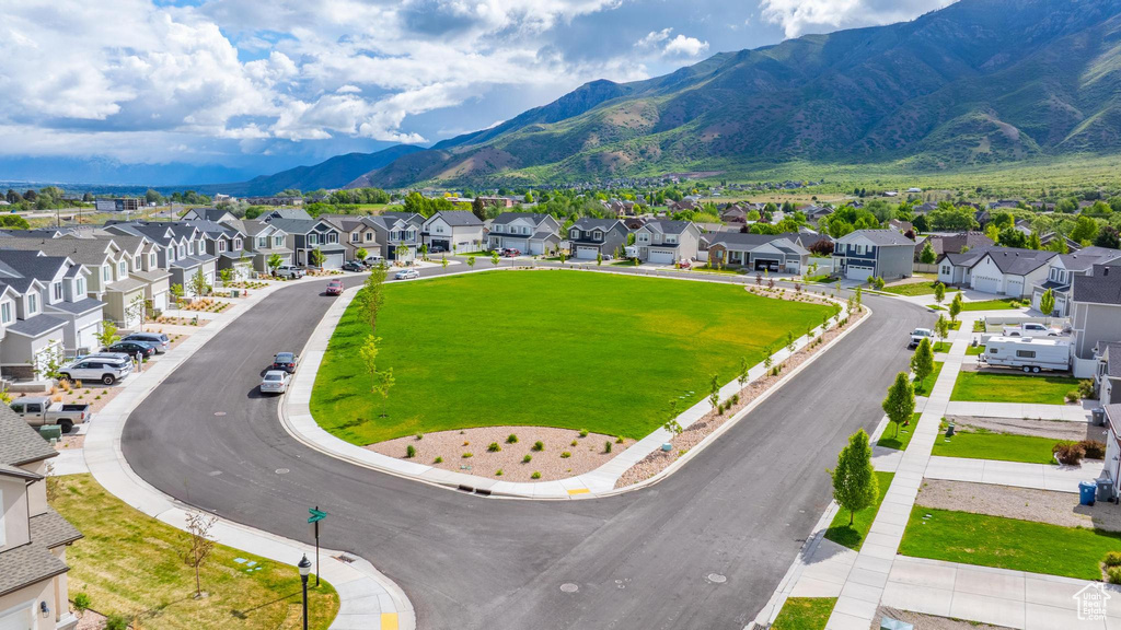 View of mountain backdrop featuring nearby suburban area