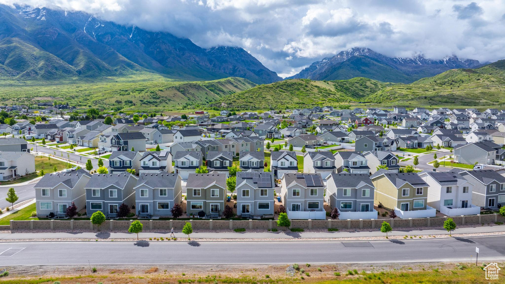 Aerial view of residential area featuring a mountainous background