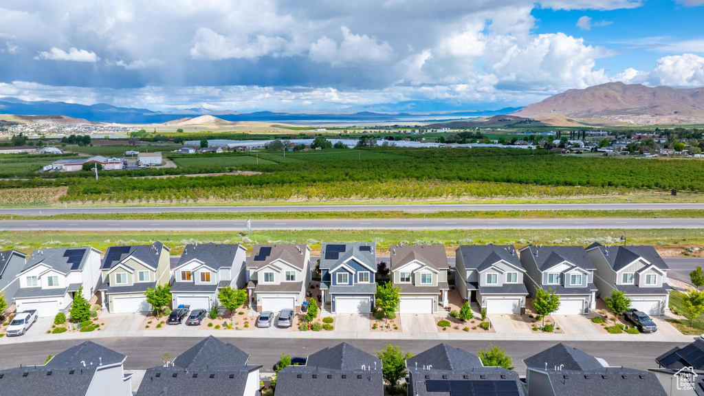 Aerial view of residential area featuring a mountain backdrop