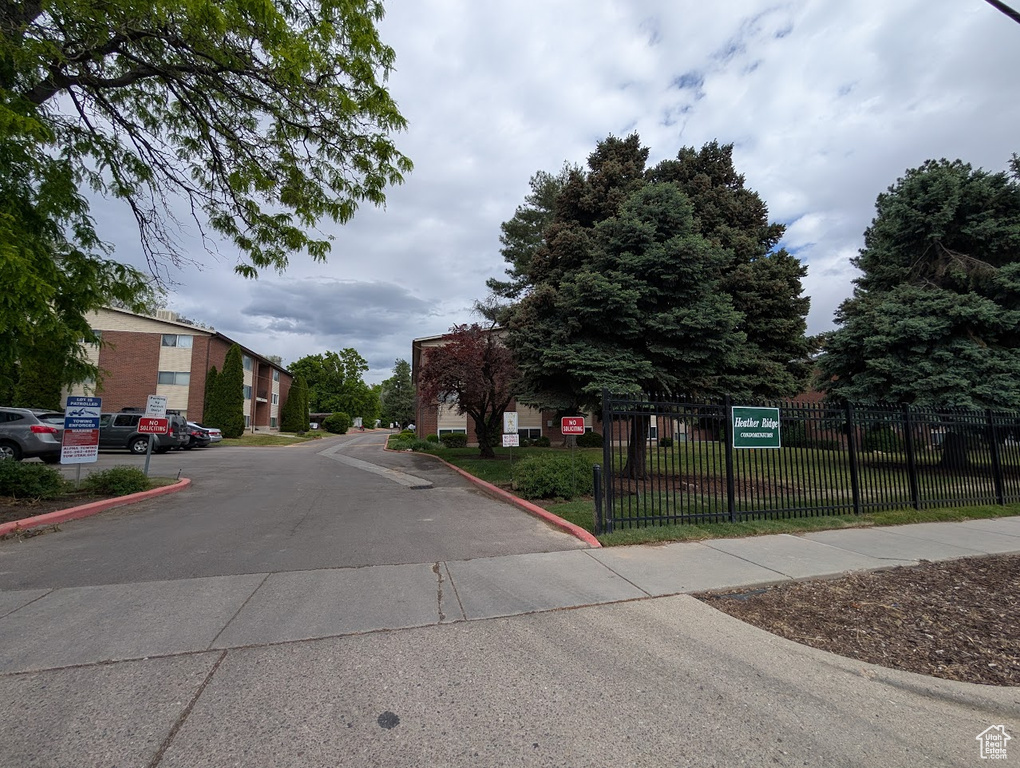 View of asphalt street featuring curbs