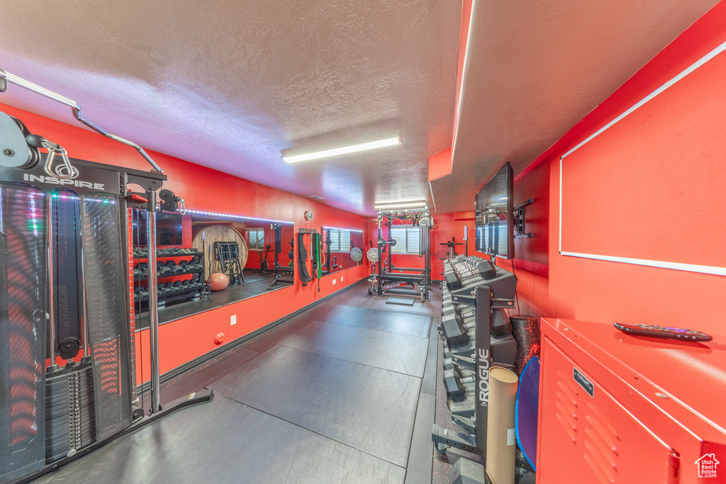 Workout area featuring a textured ceiling