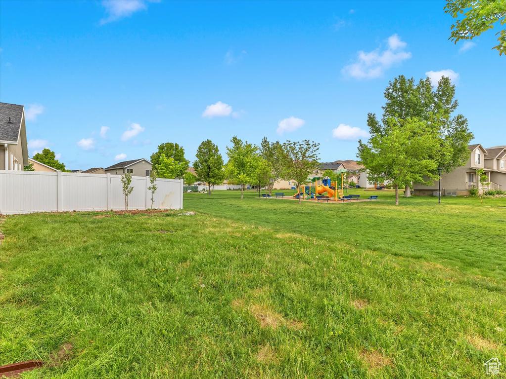 View of yard with a playground and a residential view