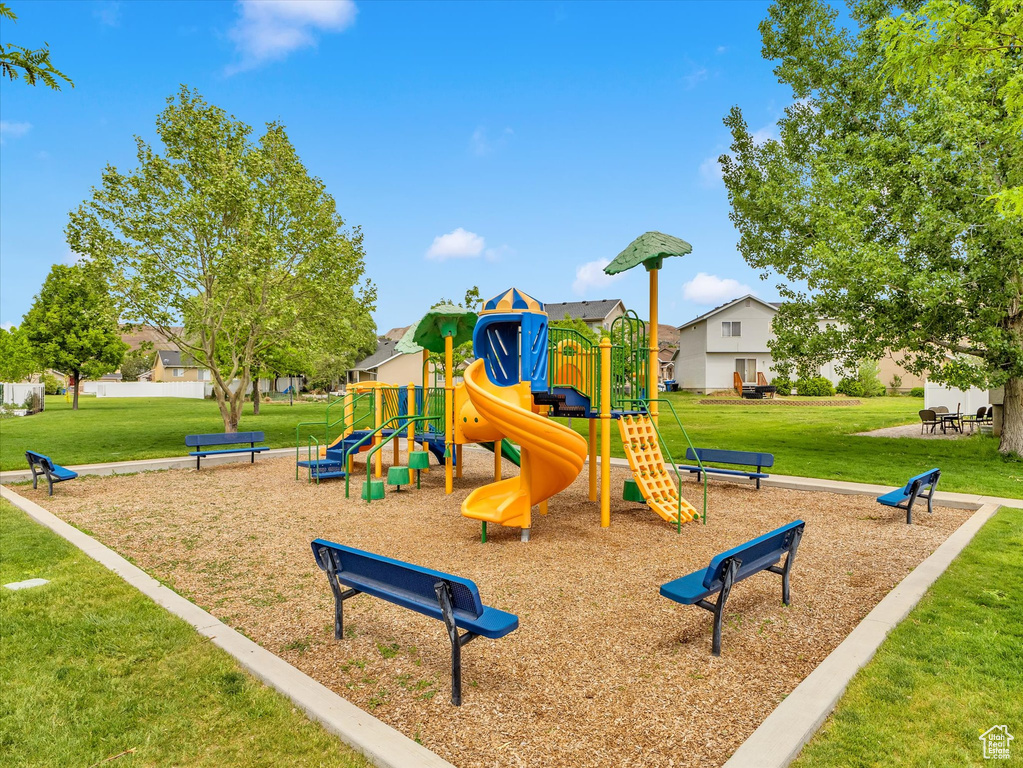 Community jungle gym with a lawn