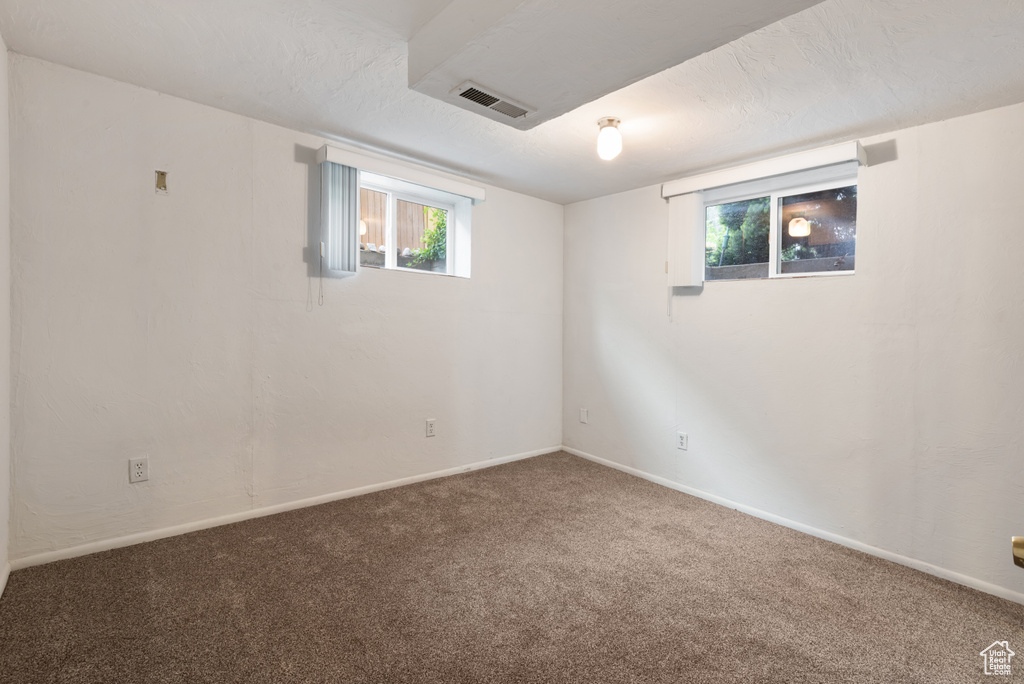 Basement with carpet flooring and baseboards