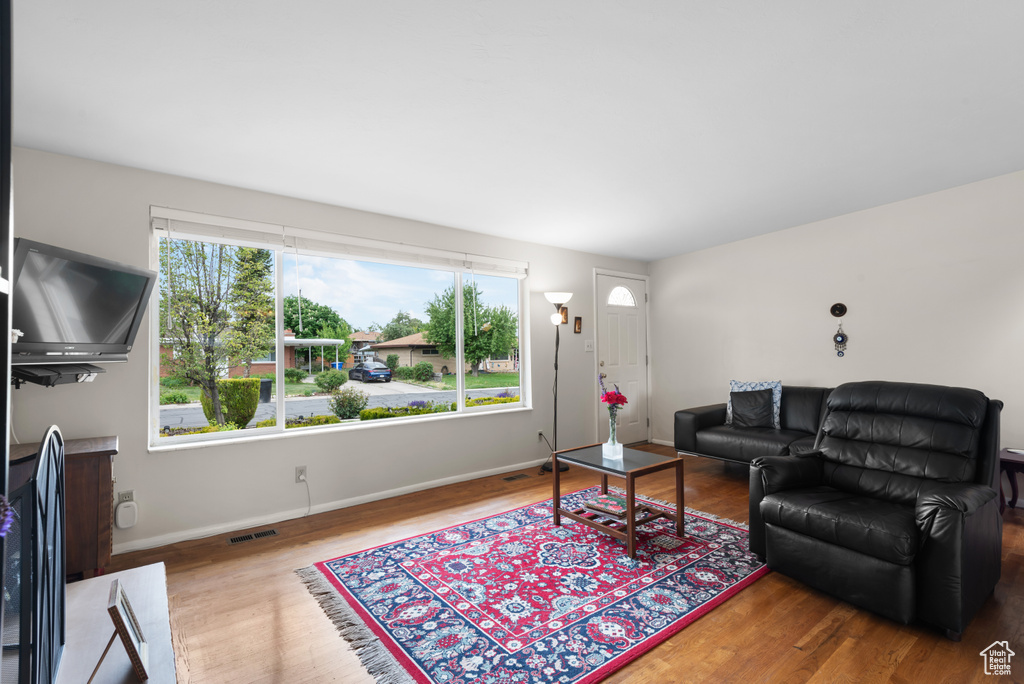 Living area featuring wood finished floors and baseboards