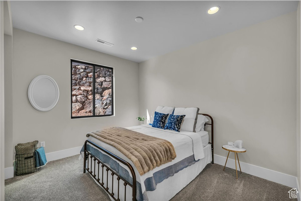 Carpeted bedroom featuring baseboards and recessed lighting