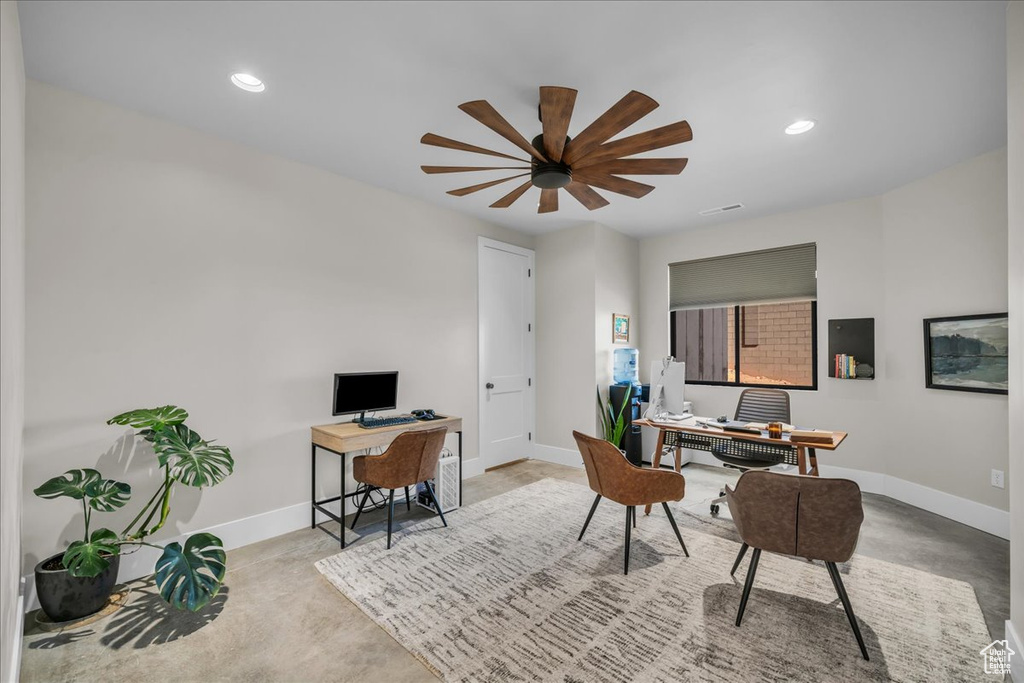 Office space featuring baseboards, concrete floors, ceiling fan, and recessed lighting