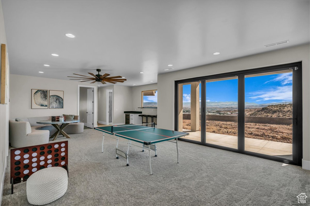Rec room with carpet, recessed lighting, a ceiling fan, and baseboards