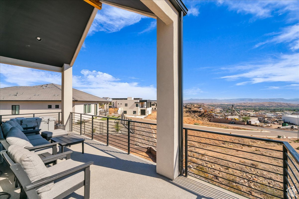 Balcony featuring a mountain view and a residential view