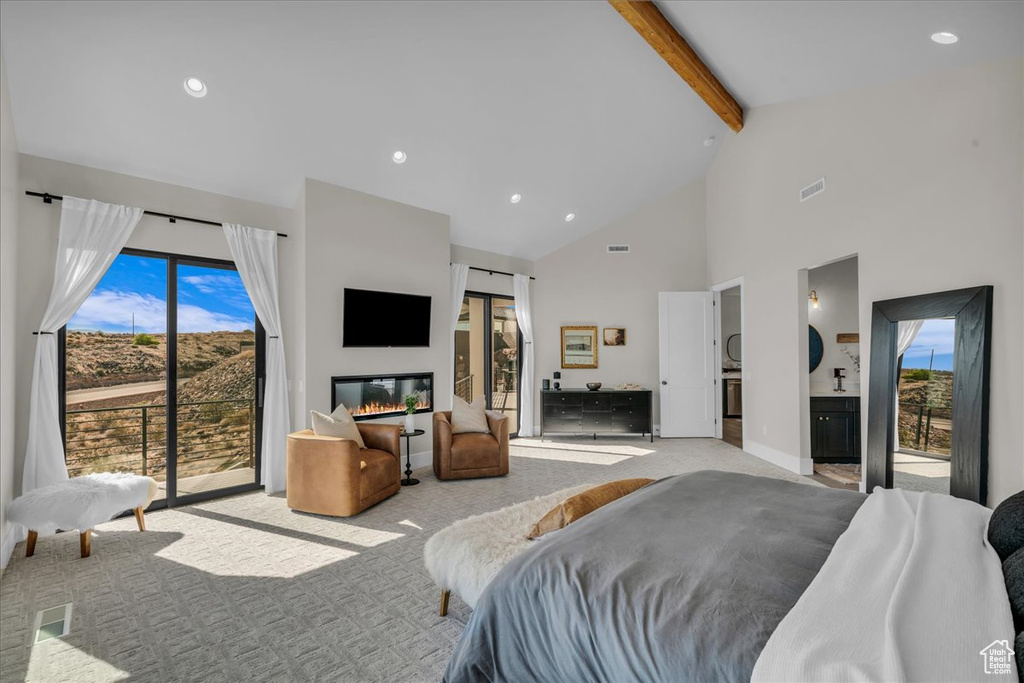 Carpeted bedroom with access to exterior, beam ceiling, high vaulted ceiling, multiple windows, and recessed lighting
