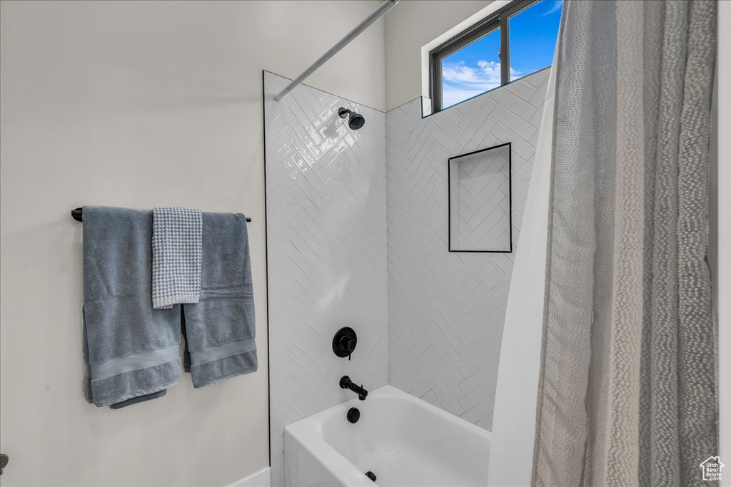 Full bath with shower / bath combination with curtain