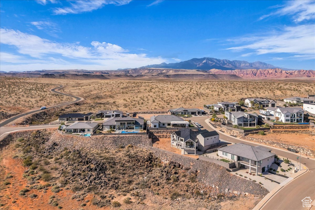 Aerial view of residential area featuring a mountainous background