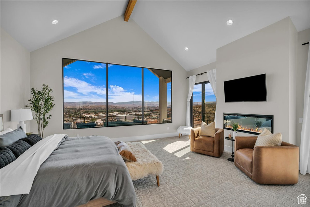 Carpeted bedroom featuring high vaulted ceiling, beamed ceiling, recessed lighting, and baseboards
