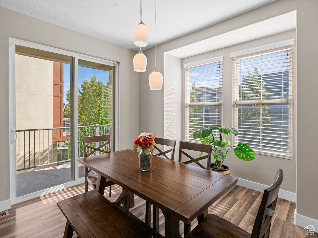 Dining room featuring baseboards and light wood-style floors