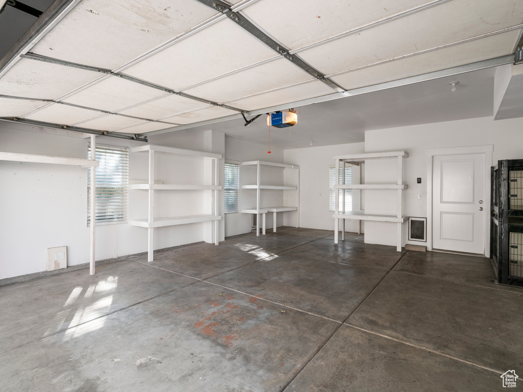 Garage featuring a garage door opener