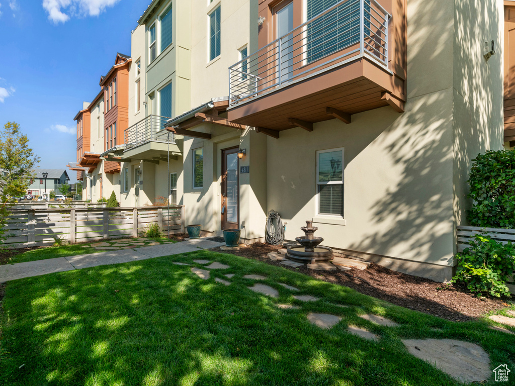 Property entrance with stucco siding and a residential view