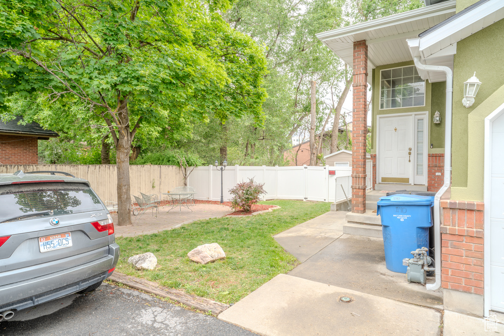 View of yard with a patio area
