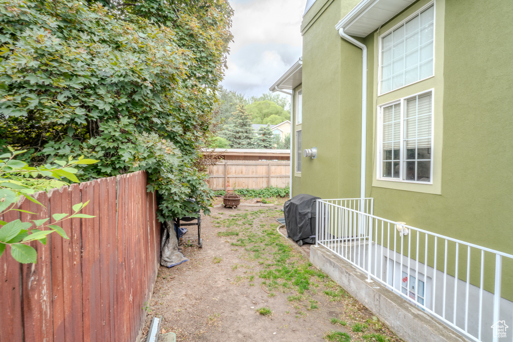View of yard featuring fence