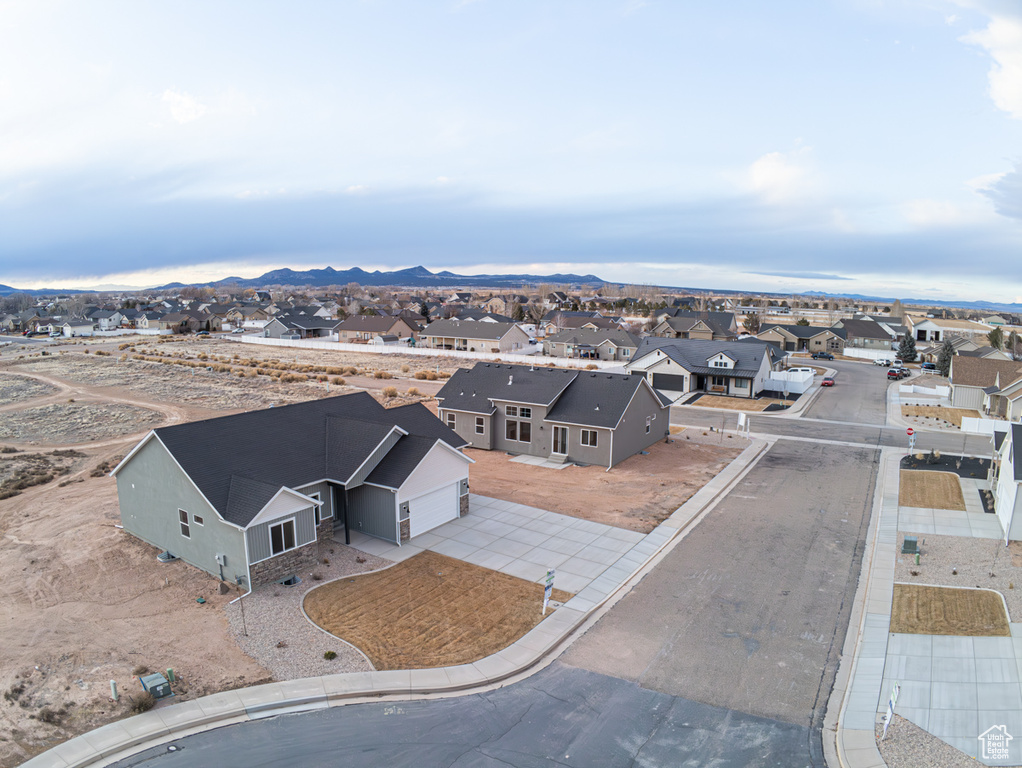 Aerial view of residential area featuring a mountainous background