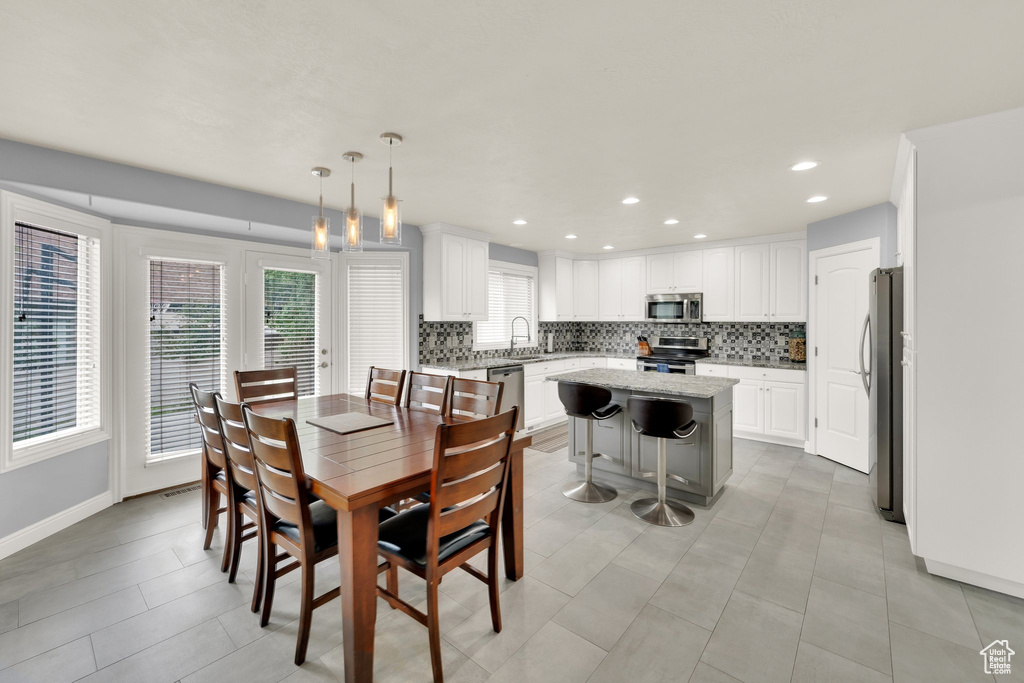 Dining room with baseboards and recessed lighting